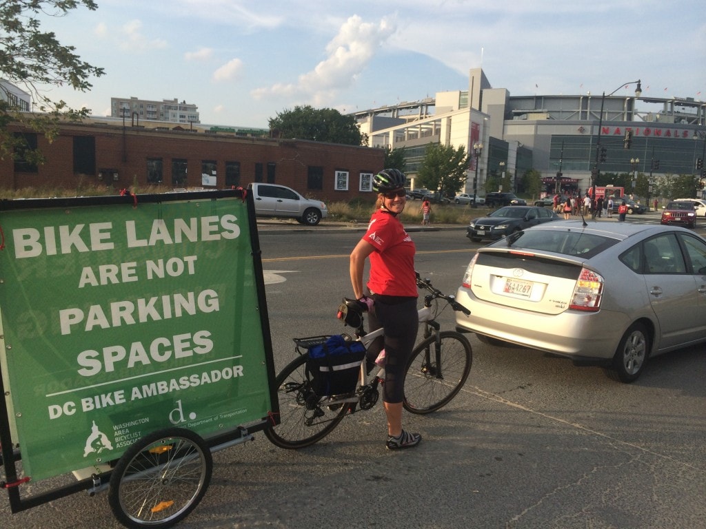 A Bike Ambassador helps pull a trailer down in SE DC