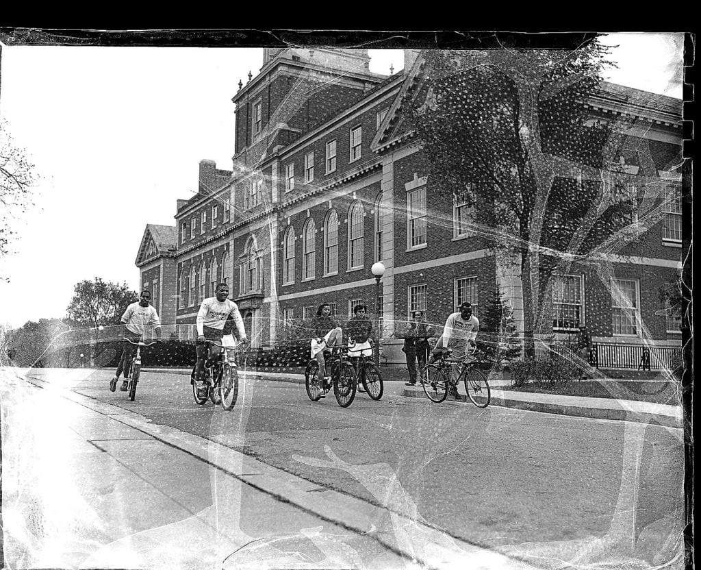 Five Howard University students riding bikes