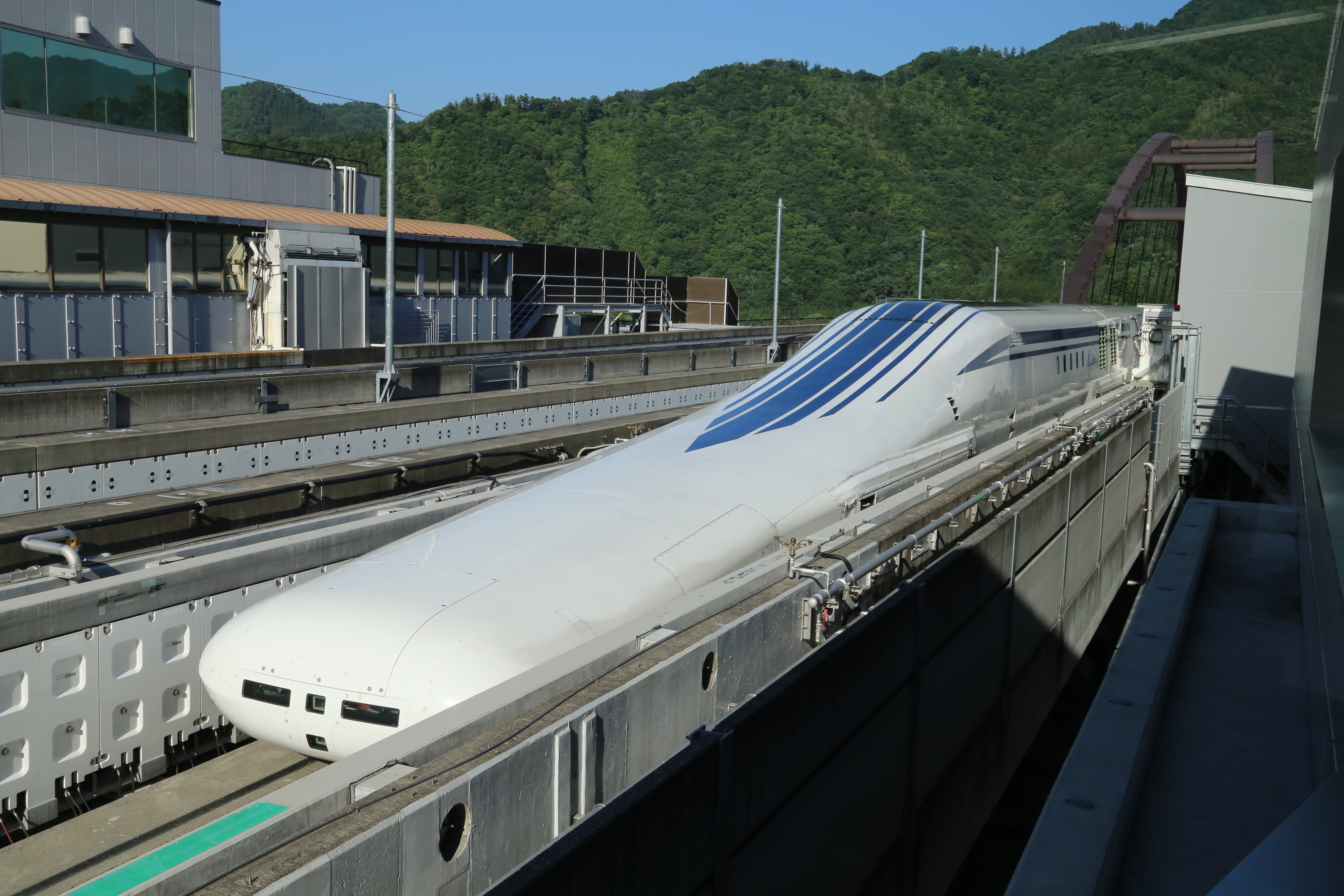 A maglev train speeds down a track