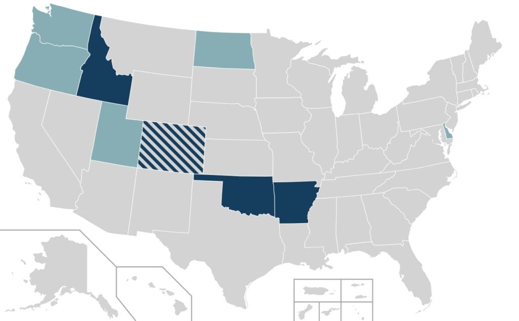 Map of states with Safety Stop laws: 

dark blue: rolling stop and red-as-stop; light blue: rolling stop only; hashed: depends on municipality

Idaho, Missouri, Oklahoma are dark blue; Washington, Oregon, Utah, North Dakota, are light blue; Colorado is hashed