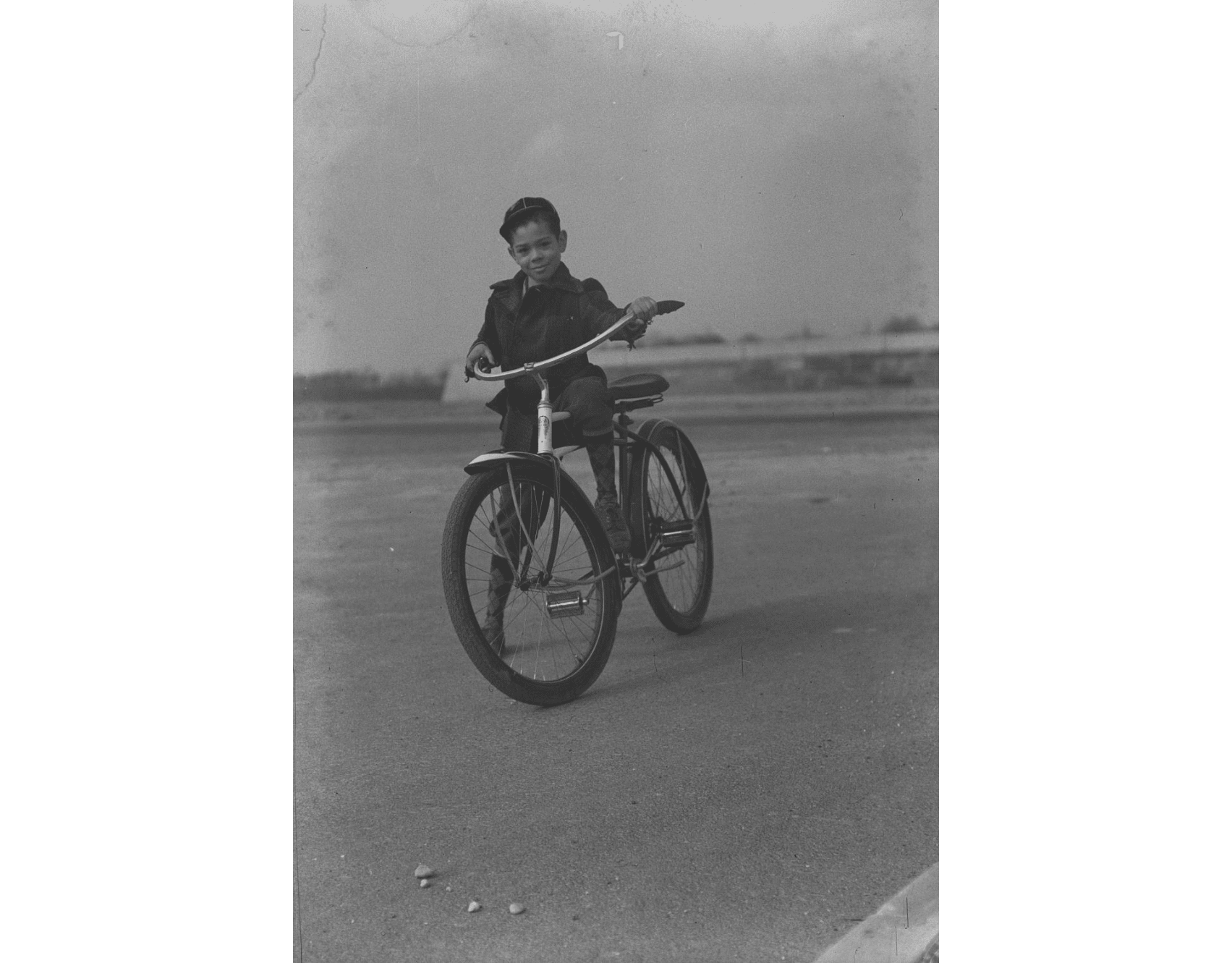 Jack Jackson faces the camera, sitting on his bike.