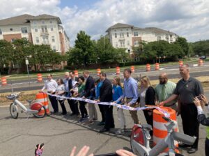 staff and advocates cutting the ribbon on the i-66 parallel trail